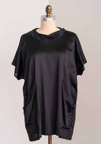 black cotton tunic against a white background