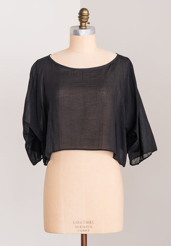 Black Japanese Tencel blouse on a mannequin with a plain white background