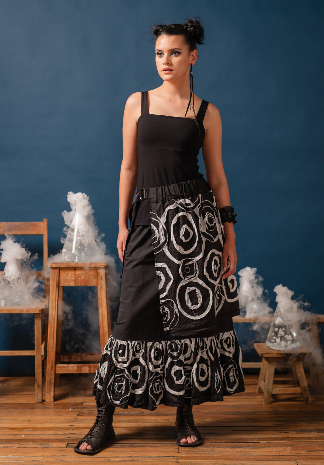 Black and white patterned skirt with a belt on a mannequin against a plain background
